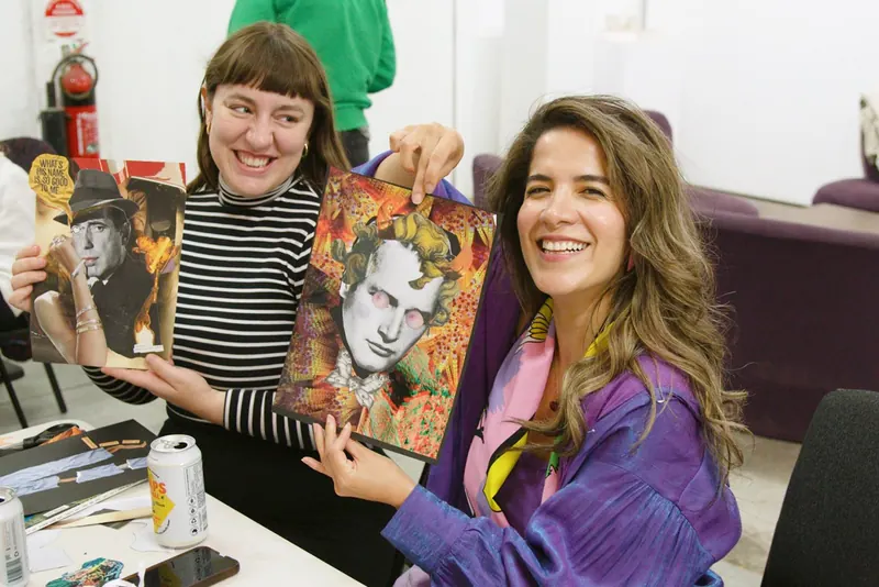Two workshop participants smiling and holding up their finished portrait collages
